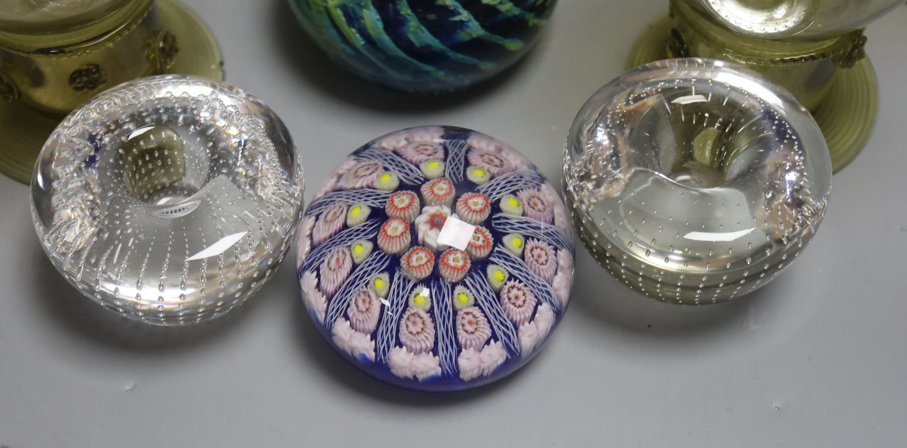 A German glass beaker with enamelled crest, 17.5cm, four Roemers, a millefiori paperweight and coloured glassware